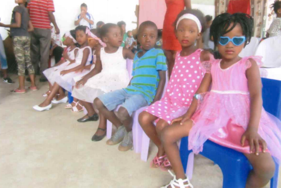 Some of the orphans that are heading for primary school are seen here watching their friends dancing in steps helped by caregivers.